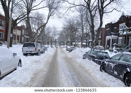 MONTREAL-CANADA DEC. 27:Cars cover of snow on Merose Street. The snow storm slam Montreal with 45 cm of snow, Canada on December 27, 2012 after knocking out power to thousands of homes in the U.S..