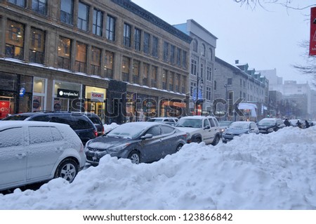 MONTREAL-CANADA DEC. 27:Cars cover of snow on St-Catherine Street. The snow storm slam Montreal with 45 cm of snow, Canada on Dec. 27, 2012 after knocking out power to thousands of homes in the U.S..
