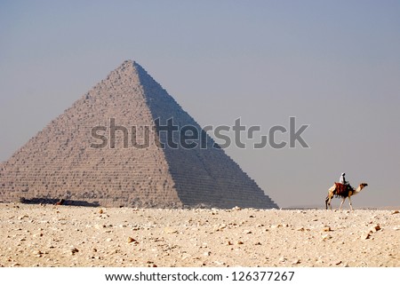 GIZA, EGYPT - NOV 15: Camel rider in front the Giza pyramid on November 15, 2009, in Giza, Egypt. The world's oldest tourist attraction, the Pyramids of Giza are nearly 5000 years old.