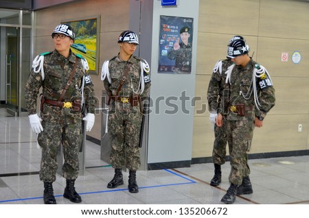DORASAN, SOUTH KOREA APRIL 7: South Korean Soldier Dorasan train station on april 07 2013 in Dorasan, South Korea. Located in DMZ between the two Koreas, Dorasan Station opened in 2002  still unused