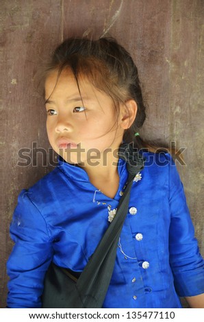 VANGVIENG LAOS APRIL 2: Portrait of unidentified poor laotian hmong child on april 2 2013 in Vangvieng Laos. More than half of the Laotian population live below the poverty line.
