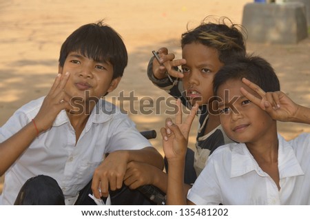 PHNOM PHEN, CAMBODIA MARCH 23: Unidentified street children posing on march 23 2013 in Phnom Phen,Cambodia.In Phnom Penh alone there are between 10,000 and 20,000 children live and work on the streets