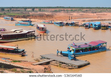 TONLE SAP CAMBODIA LAKE MARCH 31:Tourists boats on the Tonle sap River is a combined lake and river system of major importance to Cambodia on march 31 2013 in Tonle Sap Lake, Cambodia.