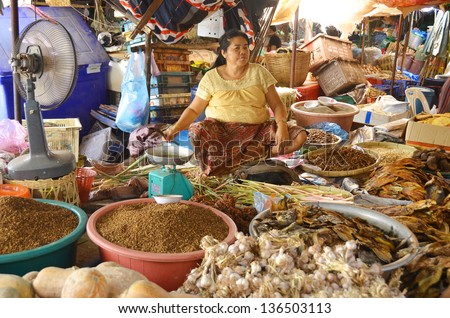 LUANG PRABANG LAOS APRIL 3: Woman sells spices at the market on 04 03 2013 in Luang Prabang Laos.The markets are filled with local vegetables and spices that are used to make the delicious Lao dishes