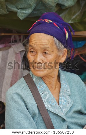 SIEM REAP CAMBODIA MARCH 27: Portrait of an unidentified old buddhist woman on march 27 2013 in Siem Reap, Cambodia. Theravada Buddhism is practiced by over 95% of Cambodians.
