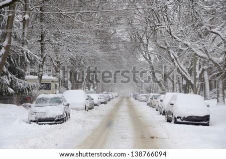 MONTREAL-CANADA DEC. 27:Cars cover of snow on Melrose Street. The snow storm slam Montreal with 45 cm of snow, Canada on December 27, 2012 after knocking out power to thousands of homes in the U.S.