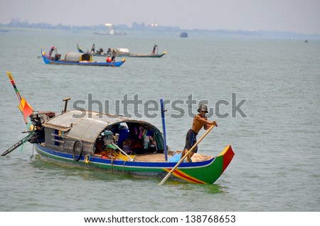 SIEM REAP, CAMBODIA - MARCH 29:People fishing on Tonle Sap Lake in Siem Reap, Cambodia on March 29, 2013. Tonle Sap is the largest freshwater lake in South East Asia peaking at 16k km2