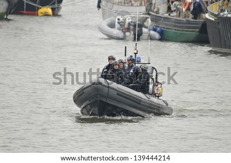 LONDON, UK-JUNE 1: Police boats watching on Thames river during the Queen's Diamond Jubilee celebrations on June 1, 2012 in London England, UK