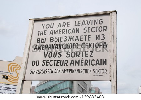 BERLIN, GERMANY-MAY 19: The famous sign at the former East-West Berlin border, the check point Charlie remembering the cold war on May 19, 2010 in Berlin Germany