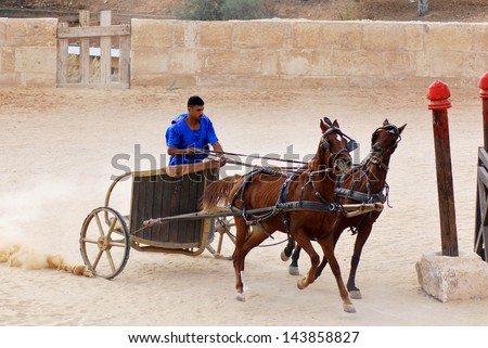 Jerash - November 25:Roman Warriors Racing With Horses And Chariots Carts During Roman Show On November 25, 2009 In Jerash, Jordan