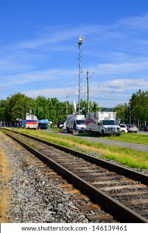 LAC MEGANTIC CANADA JULY 14: Television crews for coverage of the wost train disaster in the canadian history on july 14 2013 in Lac Megantic Canada. 50 people was killed in this humanitarian disaster