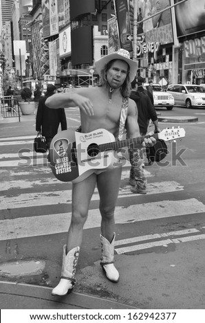 NEW YORK USA OCTOBER 29: Robert John Burck, better known as the Naked Cowboy, is an American street performer whose pitch is on New York City\'s Times Square on October 29, 2013 in New York City, NY.