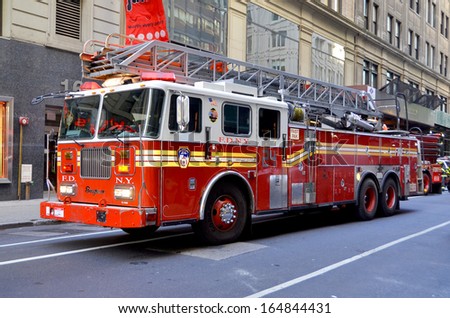 New York City Oct 27: Fdny Tower Ladder 24 Truck In Manhattan On Otc 27, 2013. Fdny Is The Largest Combined Fire And Ems Provider In The World