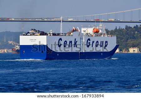 ISTANBUL TURKEY OCT. 4: The ship Cenk Group ferry  in front the Bosphorus bridge on october 4 2013 in Istanbul Turkey