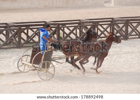 JERASH - NOVEMBER 25:Roman warriors racing with horses and chariots carts during Roman show on November 25, 2009 in Jerash, Jordan