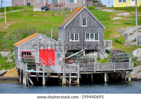 PEGGY\'S COVE NOVA SCOTIA JUNE 6: Typical fisherman house in Peggy\'s Cove a small rural community located on the eastern shore of St. Margarets Bay in Nova Scotia on june 6 2014.
