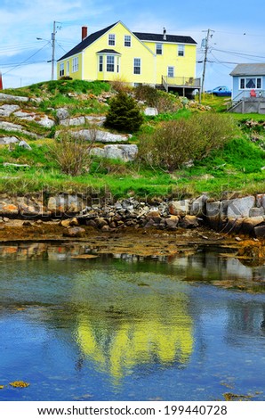PEGGY\'S COVE NOVA SCOTIA JUNE 6: Typical fisherman house in Peggy\'s Cove a small rural community located on the eastern shore of St. Margarets Bay in Nova Scotia on june 6 2014.