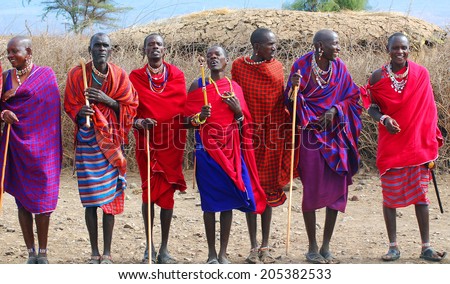AMBOSELI, KENYA - OCT 13: Unidentified African people from Masai tribe prepare to show a traditional Jump dance on Oct 13, 2011 in Masai Mara, Kenya. They are nomadic and live in small villages.