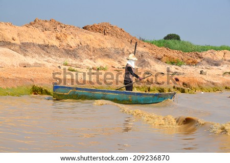 SIEM REAP, CAMBODIA - MARCH 29:People fishing on Tonle Sap Lake in Siem Reap, Cambodia on March 29, 2013. Tonle Sap is the largest freshwater lake in South East Asia peaking at 16k km2