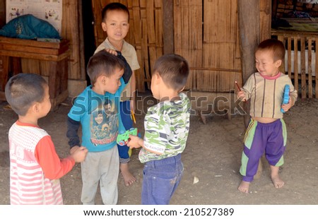 VANGVIENG LAOS APRIL 2: Portrait of unidentified poor laotian hmong children on april 2 2013 in Vangvieng Laos. More than half of the Laotian population live below the poverty line.