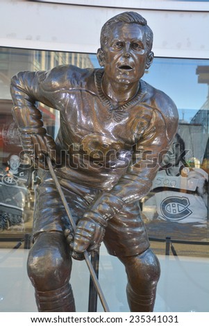 MONTREAL CANADA DEC 04: Statue of Jean Beliveau former hockey player in front the Bell Center on dec. 04 2014 in Montreal Canada. He was inducted into the Hockey Hall of Fame in 1972.
