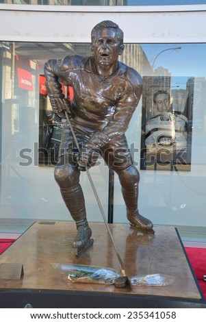 MONTREAL CANADA DEC 04: Statue of Jean Beliveau former hockey player in front the Bell Center on dec. 04 2014 in Montreal Canada. He was inducted into the Hockey Hall of Fame in 1972.