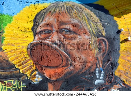 PARIS FRANCE OCT 19: Street art Indian tribe Kayapo in Paris France october 19 2014. Paris is the perfect place to walk in the back alleys and abandoned areas, looking for fresh air and street art.