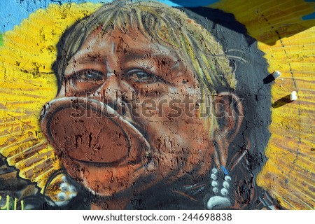 PARIS FRANCE OCT 19: Street art Indian tribe Kayapo in Paris France october 19 2014. Paris is the perfect place to walk in the back alleys and abandoned areas, looking for fresh air and street art.