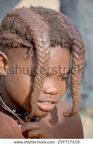 KHORIXAS, NAMIBIA OCTOBER 09, 2014: Unidentified child from Himba tribe. The Himba are indigenous peoples living in northern Namibia, in the Kunene region of South-West Africa on october 09 2014
