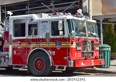 NEW YORK CITY OCT 27: FDNY Tower Ladder 5 truck in Manhattan on Otc 27, 2013. FDNY is the largest combined Fire and EMS provider in the world