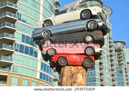 VANCOUVER BC CANADA JUNE 9 2015: Trans Am Totem is a meditation on contemporary technological culture The sculpture is comprised of 5 discarded automobiles placed on top of aN old growth cedar tree.
