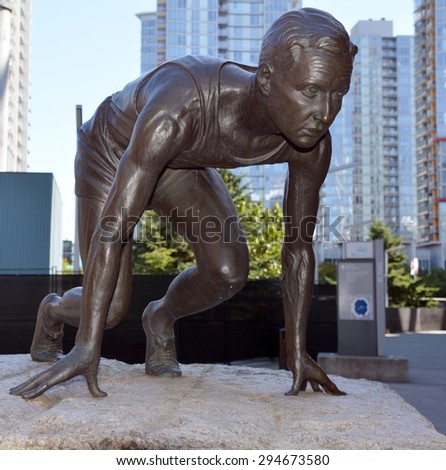 VANCOUVER BC CANADA JUNE 27 2015: Statue of Percy Williams, Olympic runner, outside BC Place Stadium. Winner of the 100 m and 200 m races at the 1928 Summer Olympics  in Amsterdam Netherlands.