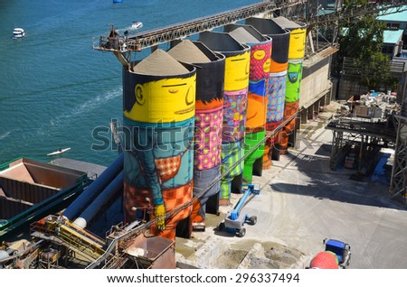 VANCOUVER BC CANADA JUNE 10 2015: Ocean Concrete is Granville Island last tie to its industrial past, and now 6 concrete silos are being transformed by two famous Brazilian street artists Os Gemeos