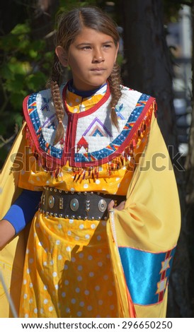 VICTORIA BC CANADA JUNE 24 2015: Unidentified Native Indian girl in traditional costume. First Nations in BC constitute a large number of First Nations governments and peoples in the province of BC