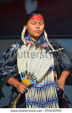VICTORIA BC CANADA JUNE 24 2015: Unidentified Native Indian woman in traditional costume. First Nations in BC constitute a large number of First Nations governments and peoples in the province of BC