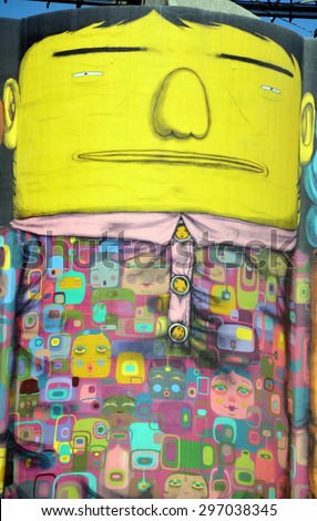 VANCOUVER BC CANADA JUNE 10 2015: Ocean Concrete is Granville Island last tie to its industrial past, and now 6 concrete silos are being transformed by two famous Brazilian street artists Os Gemeos