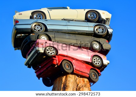 VANCOUVER BC CANADA JUNE 9 2015: Trans Am Totem is a meditation on contemporary technological culture The sculpture is comprised of 5 discarded automobiles placed on top of aN old growth cedar tree.