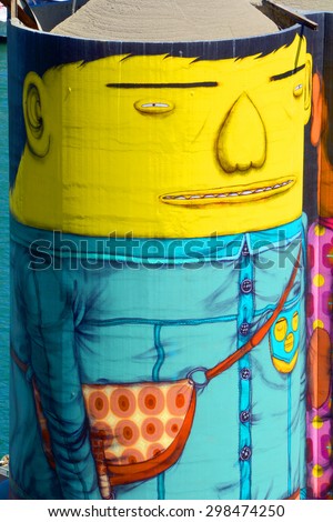 VANCOUVER BC CANADA JUNE 10 2015: Ocean Concrete is Granville Island last tie to to its industrial past, and now 6 concrete silos are being transformed by two famous Brazilian street artists Os Gemeos