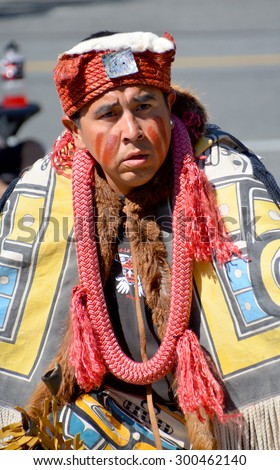 VICTORIA BC CANADA JUNE 24 2015: Native Indian man in traditional costume. First Nations in BC constitute a large number of First Nations governments and peoples in the province of British Columbia