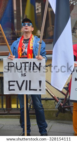 TALLINN ESTONIA 09 27 2015: Anti-Russian against V.Putin protest in connection with military aggression of Russia against Ukraine and flight MH317 Malaysian air line in front the Russian embassy.