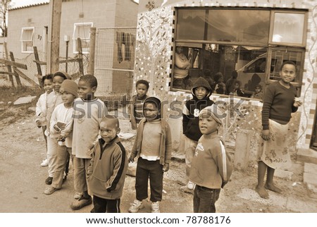 KHAYELITSHA, CAPE TOWN - MAY 22 : A unidentified group of young children play on a street of Khayelitsha township, on May 22, 2007, Cape Town, South Africa Khayelitsha is township in Western Cape, SA