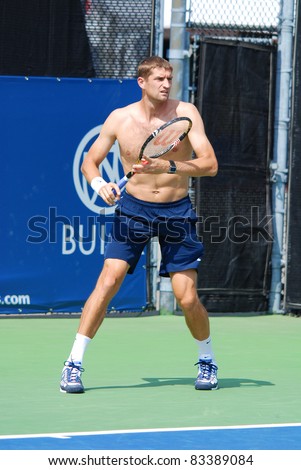stock-photo-montreal-august-max-mirnyi-on-training-court-of-montreal-rogers-cup-on-august-in-83389084.jpg
