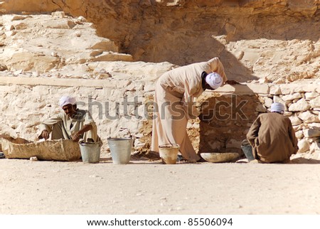 VALLEY OF THE KINGS, EGYPT- NOV 22: Unidentified men work for excavation of tombs and buried treasure on November 22, 2009, Valley of the Kings, Egypt, often called the Valley of the Gates of the Kings