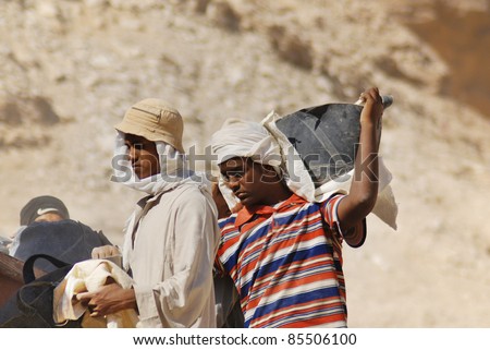 VALLEY OF THE KINGS, EGYPT- NOV 22: Unidentified men work for excavation of tombs and buried treasure on November 22, 2009, Valley of the Kings, Egypt, often called the Valley of the Gates of the Kings