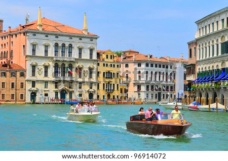 VENICE - JUNE 12: Tourists visit the Grand canal on June 11, 2011 in Venice, Italy. More than 20 million tourists come to Venice annually.