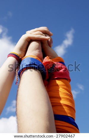 Hands on top of each other. Symbolic picture