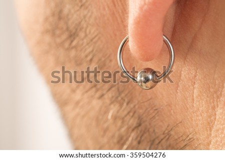 pierced ear of a  man