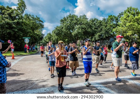 Houston - Texas - July 4:  High school band marching in neighborhood  Independence day parade on July 4th 2015 in Houston, Texas.