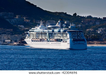 Cruise ship anchored in harbor.