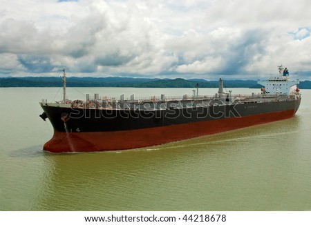 Empty cargo container ship cruising in bay.